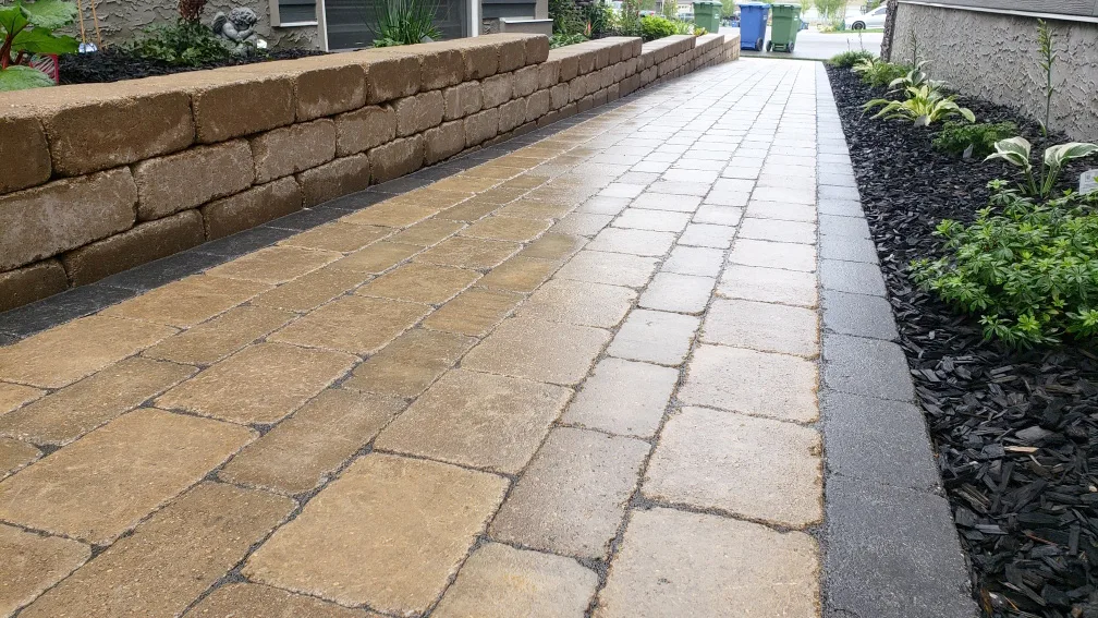 Natural stone retaining wall built into a Calgary slope